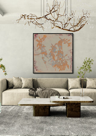botanical poems 1 by Iris Lehnhardt in a black frame above a cream sofa under a branch chandelier