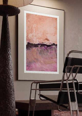 expressive landscape by Iris Lehnhardt framed in a dim room beside a tubular steel chair