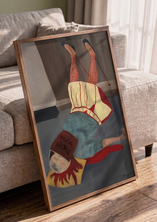 Overmeesterd door hypochondrie by Julian staal in a walnut frame leaning against a grey sofa