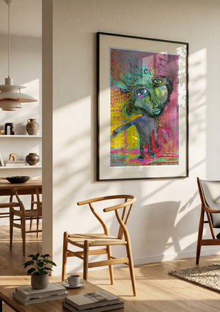 Strange Wanderer by Lena Galé in a black frame in a bright dining room with wooden chairs