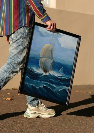 Full Sail by Justyna Kopania carried in a black frame along a sunny street