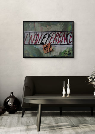 Indifference kills by PeKo in a black frame above a dark sofa with candlesticks on a round table