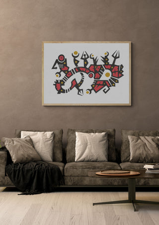 Red and Gold Glyphs by John Larkin in a light oak frame above a grey sofa on a warm brown wall