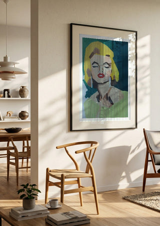 Marilyn Monroe by creatievananne in a black frame in a bright dining room with wooden chairs