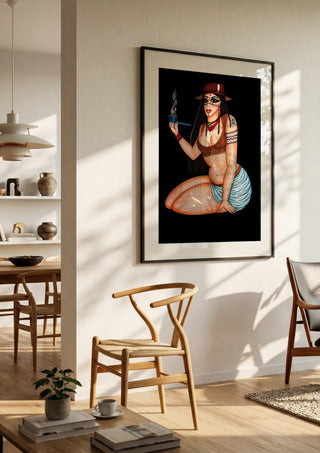 Peacepipe by KaroGaiaArt in a black frame in a bright dining room with wooden chairs