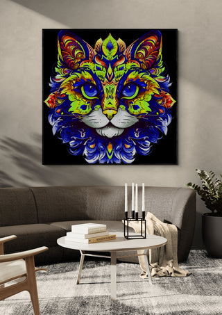 The Ornamental Cat by BunteBeute in a black frame above a dark sofa with candlesticks on a round table