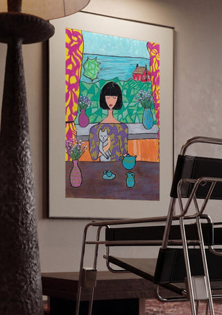 Tea by the Sea by Camilla Nilsson framed in a dim room beside a tubular steel chair
