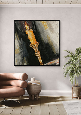 The night by Christin in a black frame above a leather armchair beside a potted palm