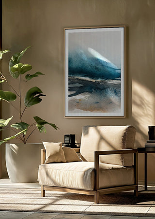Imposed memories by Tania Zubareva framed above a beige armchair beside a potted plant