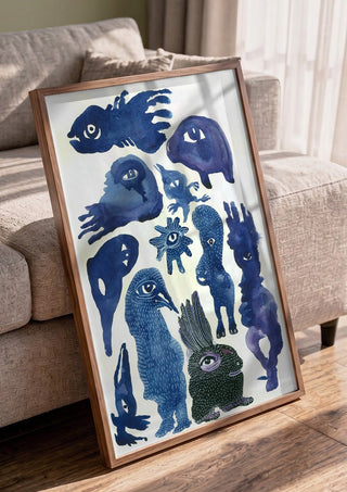 Creatures 2 by Lena Galé in a walnut frame leaning against a grey sofa