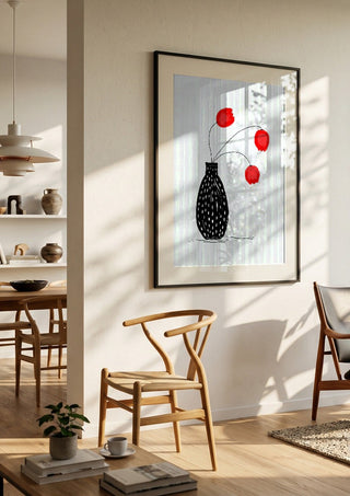 Three happy tulips by Creationsbyeditabrus in a black frame in a bright dining room with wooden chairs