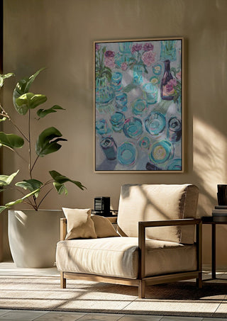 Garden Summer Party by DNF framed above a beige armchair beside a potted plant