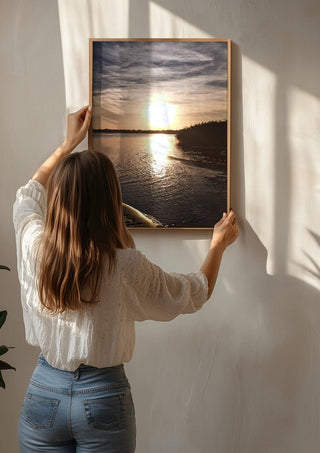 Light Finding the Shore by Bora Kőhalmi being hung on a sunlit wall