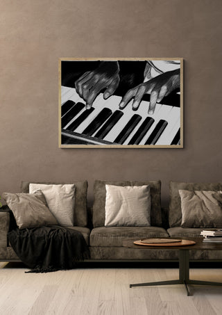 Black and White by Massimo Frascogna in a light oak frame on a warm grey wall above a brown sofa