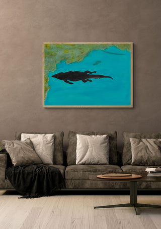 Crocodile swimming past by Sulaika Martis in a light oak frame on a warm grey wall above a brown sofa