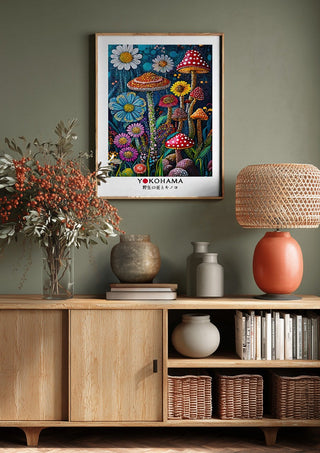 Wild Flowers and Mushrooms by Yokohama above a wooden sideboard on a sage green wall