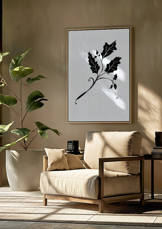 Leife by FridaRit framed above a beige armchair beside a potted plant