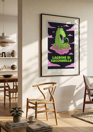 Crocodile Tears by Elisa Albanelli in a black frame in a bright dining room with wooden chairs