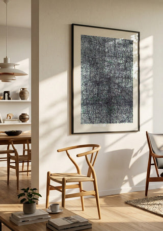 Targeted by Priit Ruttas in a black frame in a bright dining room with wooden chairs