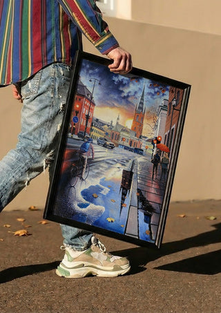 Stockholms promenad by Ramz Gadzh carried in a black frame along a sunny street
