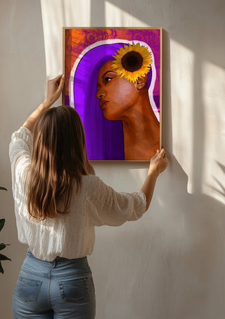 Golden Focus by Sabrina Rosenblatt being hung on a sunlit wall