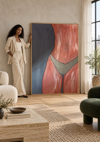 Bare Confidence by Bibi in a tall wooden frame leaning against a wall in a sunlit room