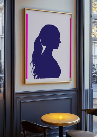 Femininity by Tonia in an oak frame on a panelled café wall