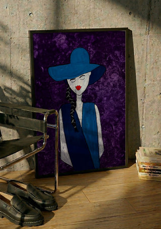 The Midnight Silhouette by Bibi in a black frame leaning against a concrete wall by a steel chair