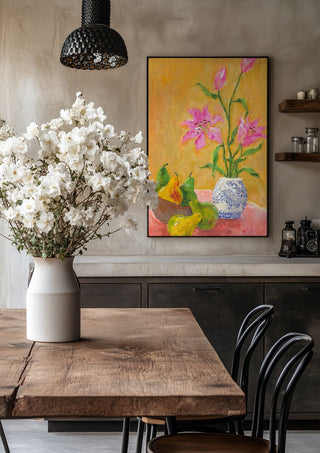 Lillies by Deblina Dey in a black frame above a rustic table with white flowers