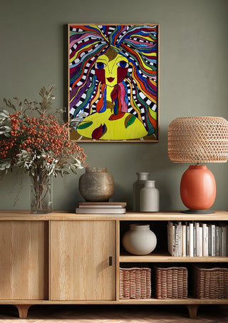 Kaleidoscopic Minds by Bibi above a wooden sideboard on a sage green wall