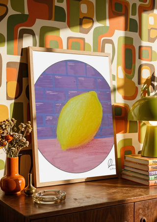ABCitron by L.OE. Art in a wooden frame on a sideboard against retro patterned wallpaper