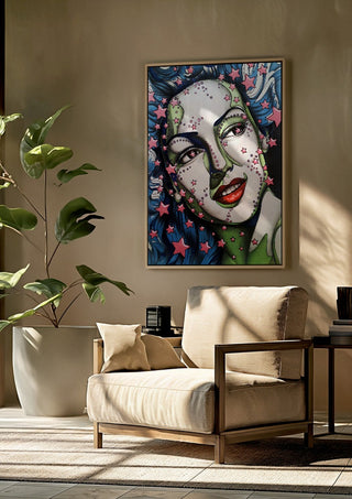 StarLady by Okiana framed above a beige armchair beside a potted plant