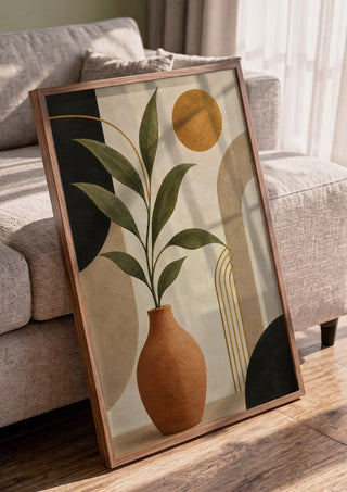 Terracotta Vase with Green Leaves by TimlessArtworks in a walnut frame leaning against a grey sofa