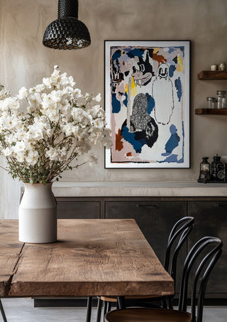 I CRACKED THE BED, THE GHOST WAS UNDER by Oscar Birch in a black frame above a rustic table with white flowers