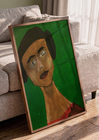 Sinthea by Ian Frederick Harris in a walnut frame leaning against a grey sofa
