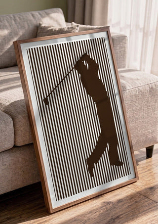 golf sport silhouette by nyai in a walnut frame leaning against a grey sofa