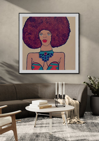 Afrocentric Radiance by Bibi in a black frame above a grey sofa with candlesticks