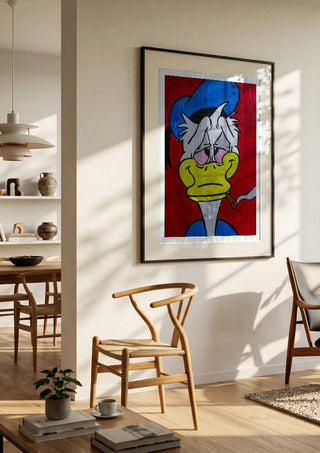 Duck in Dystopia by Bibi in a black frame in a bright dining room with wooden chairs