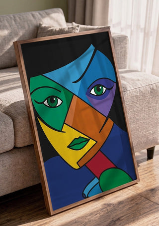 Mosaic of the Psyche by Bibi in a walnut frame leaning against a grey sofa