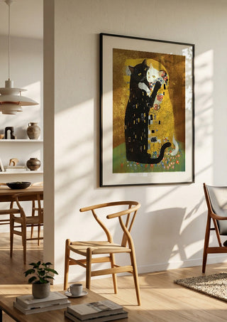Kitty Kiss by Dikhotomy in a black frame in a bright dining room with wooden chairs