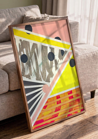 A favourite crossing by Vanyay in a walnut frame leaning against a grey sofa