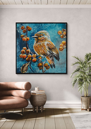 Bird on the autumn tree by Svetla Stoyanova Bassi in a black frame above a pink armchair beside a palm