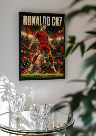 Ronaldo CR7 by Danii Steinfeldt in a black frame above a glass table with crystal glassware