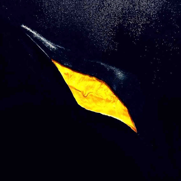 The golden crack by Marcel Herrmann - a glowing gold rift running diagonally across a deep blue-black ground