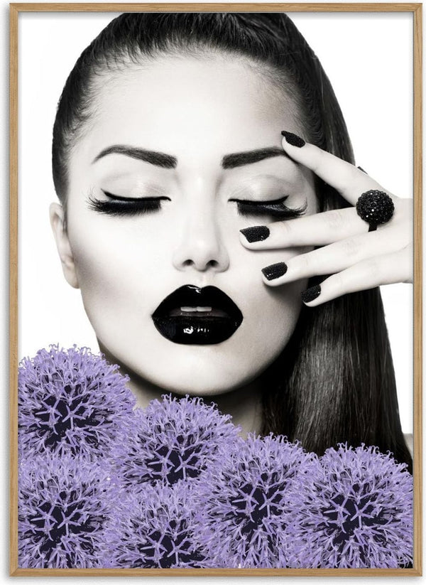 Stylish woman with black lips and nails, posing with hand near face, surrounded by purple flowers.