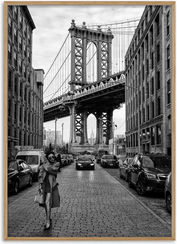 Black and white photo of a woman walking under Manhattan Bridge, featured on Oblivious by Robert Bolton product page.