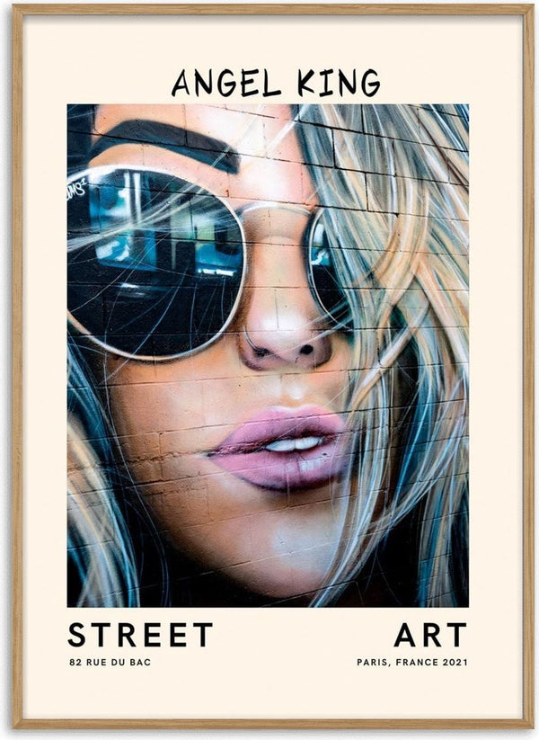 Street art mural of a woman's face with sunglasses, featured on the Angel King Plakat product page.