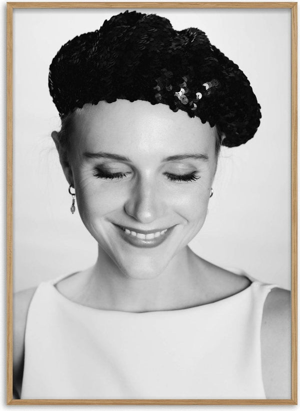 The French girl by Bettinafloorphoto - a smiling young woman in a black sequinned beret