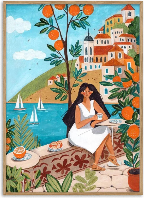Woman in white dress enjoys coffee by the sea, surrounded by orange trees and Mediterranean coastal houses.